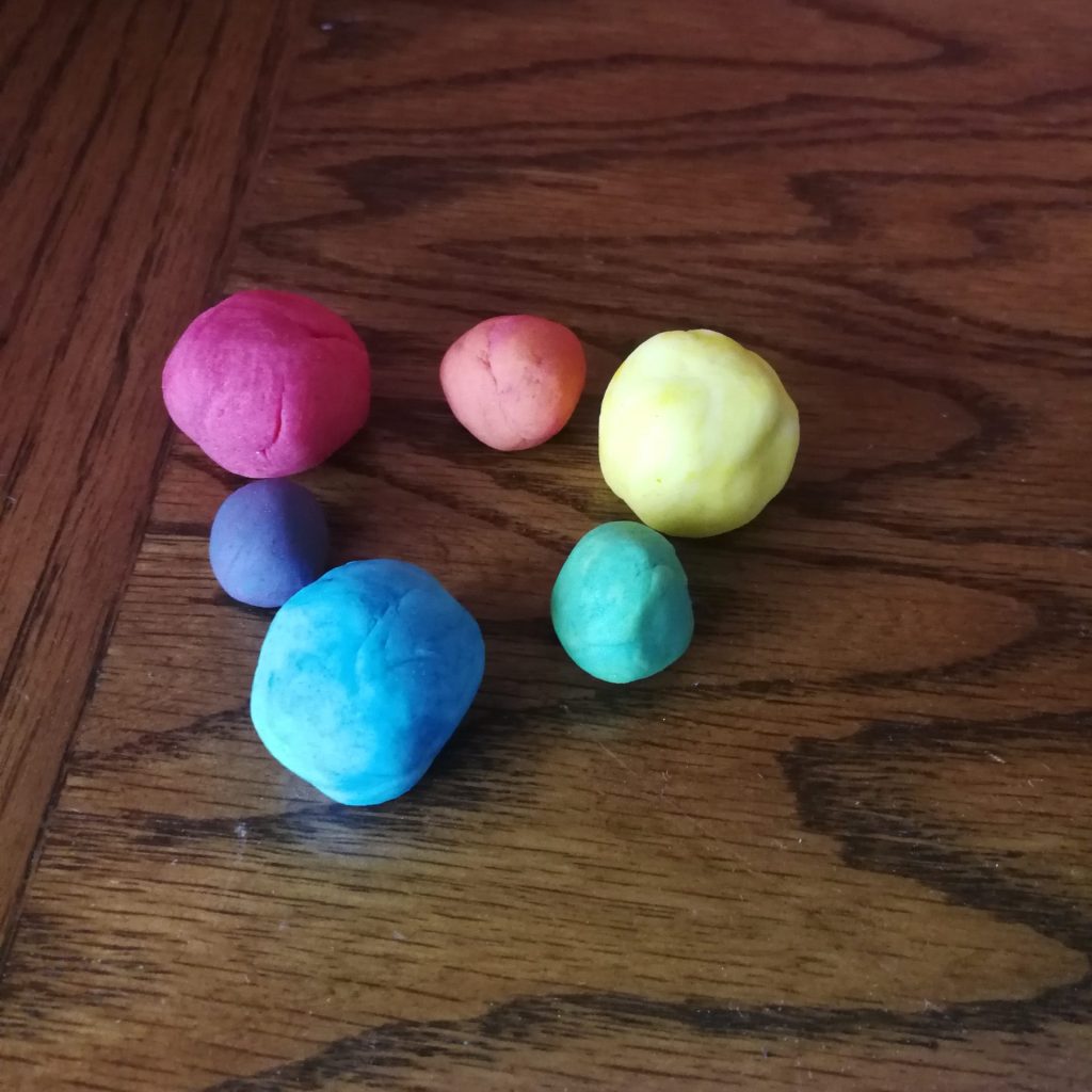 Image of the primary and secondary colours made from playdoh