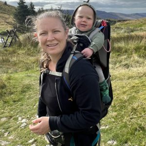 Photo of Jennifer from barefoot Bliss and Books hiking in the mountains