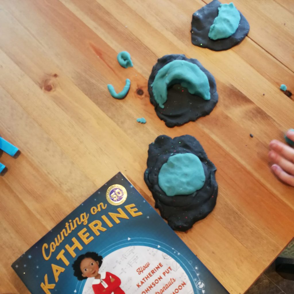 Child made phases of the moon out of playdoh